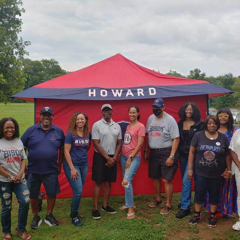 HUAC Richmond members posing for a photo under a Howard tent