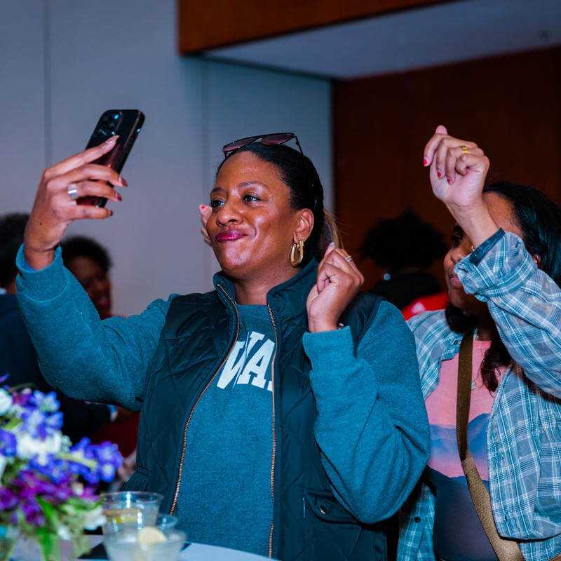 Two women taking a selfie at the Howard Homecoming "Wine Down" event