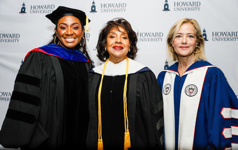 alumni at graduation with Dean Rashad