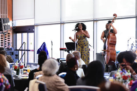 Woman singing on stage at Jazz 