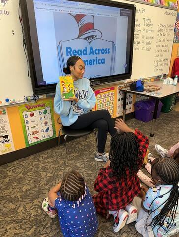 Alexandria Fuller on her Alternative Spring Break reading to children