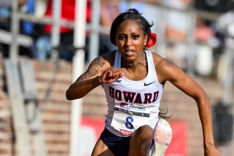 HU Bison hurdler going over a hurdle