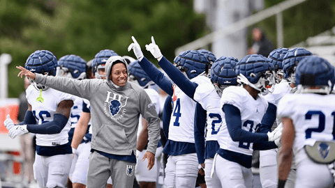 HU Bison defense on the sidelines pointing something out with a coach at the Spring Game