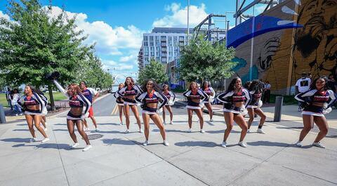 Bison cheer team on the street