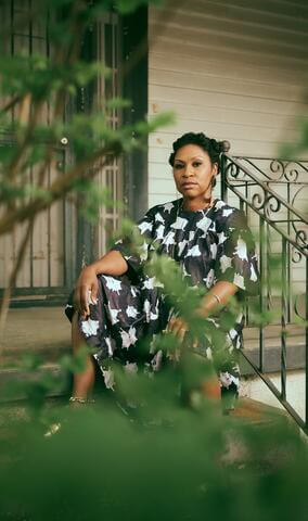 Shantrelle Lewis portrait on a porch