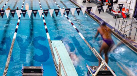 HU Swimmer about to dive into pool