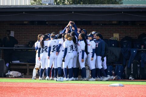 Team huddling in the dugout